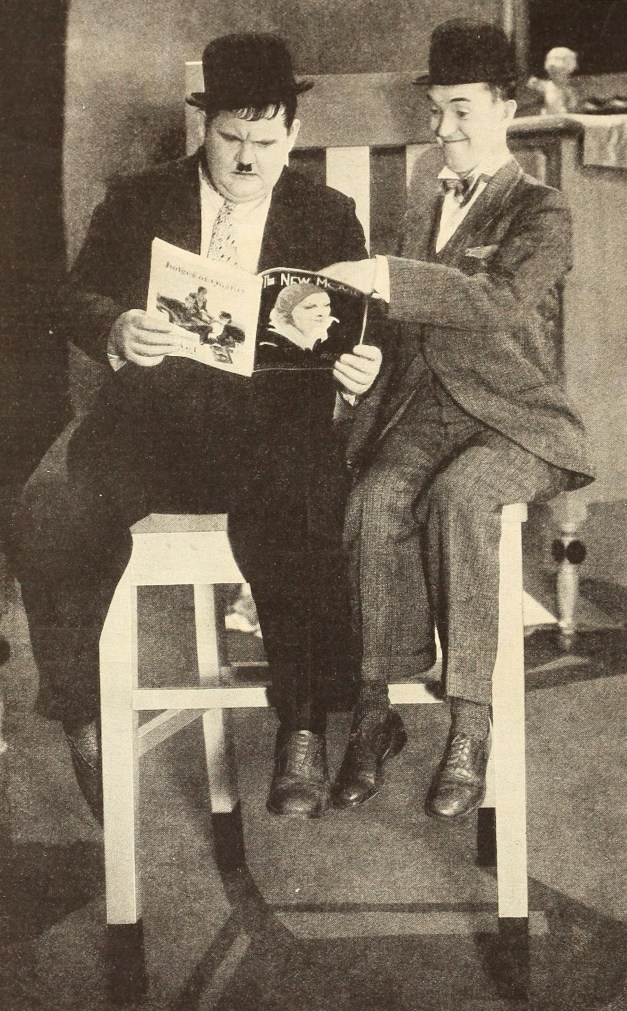 Laurel_&_Hardy_reading_The_New_Movie.jpg